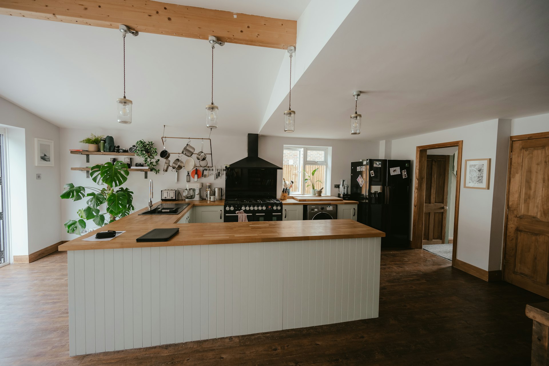 a kitchen with a bar and island